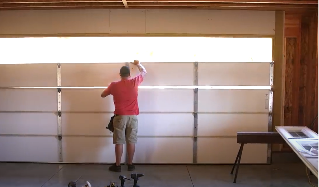 Professional technician performing a garage door section replacement, highlighting expert service by Local Garage Door Repair in Punta Gorda, FL