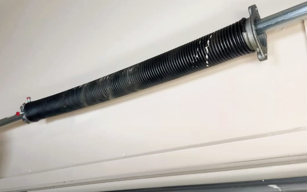 Technician performing a garage door spring repair in Punta Gorda, FL, ensuring smooth and safe door operation