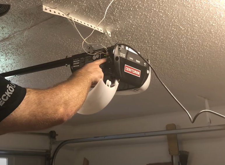 Technician performing garage door opener repair in Punta Gorda, FL, ensuring smooth and reliable operation for a residential garage