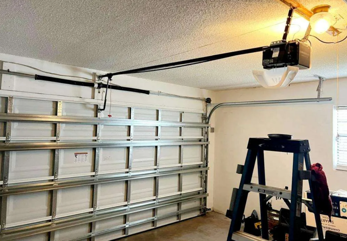 A technician repairing a residential garage door in Punta Gorda, FL, emphasizing same-day garage door repair services.