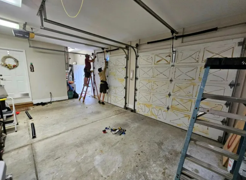 Expert technician performing garage door repair in Punta Gorda, FL with professional tools and equipment