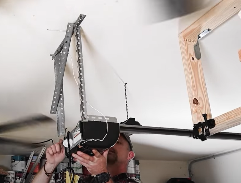 Technician performing garage door opener repair in Punta Gorda, FL with advanced tools