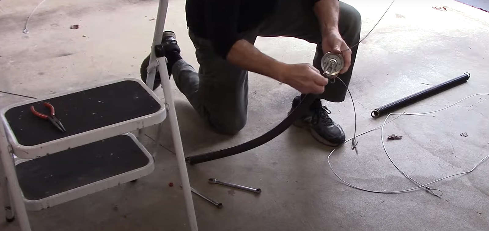 Professional garage door spring repair in progress in Punta Gorda, FL.